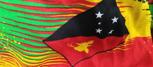 PNG  Fabric - Rayon Red/Black/Green with PNG Flag 1.1m wide